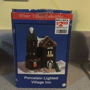 Vintage porcelain lighted village in Winter village collectibles does light up
